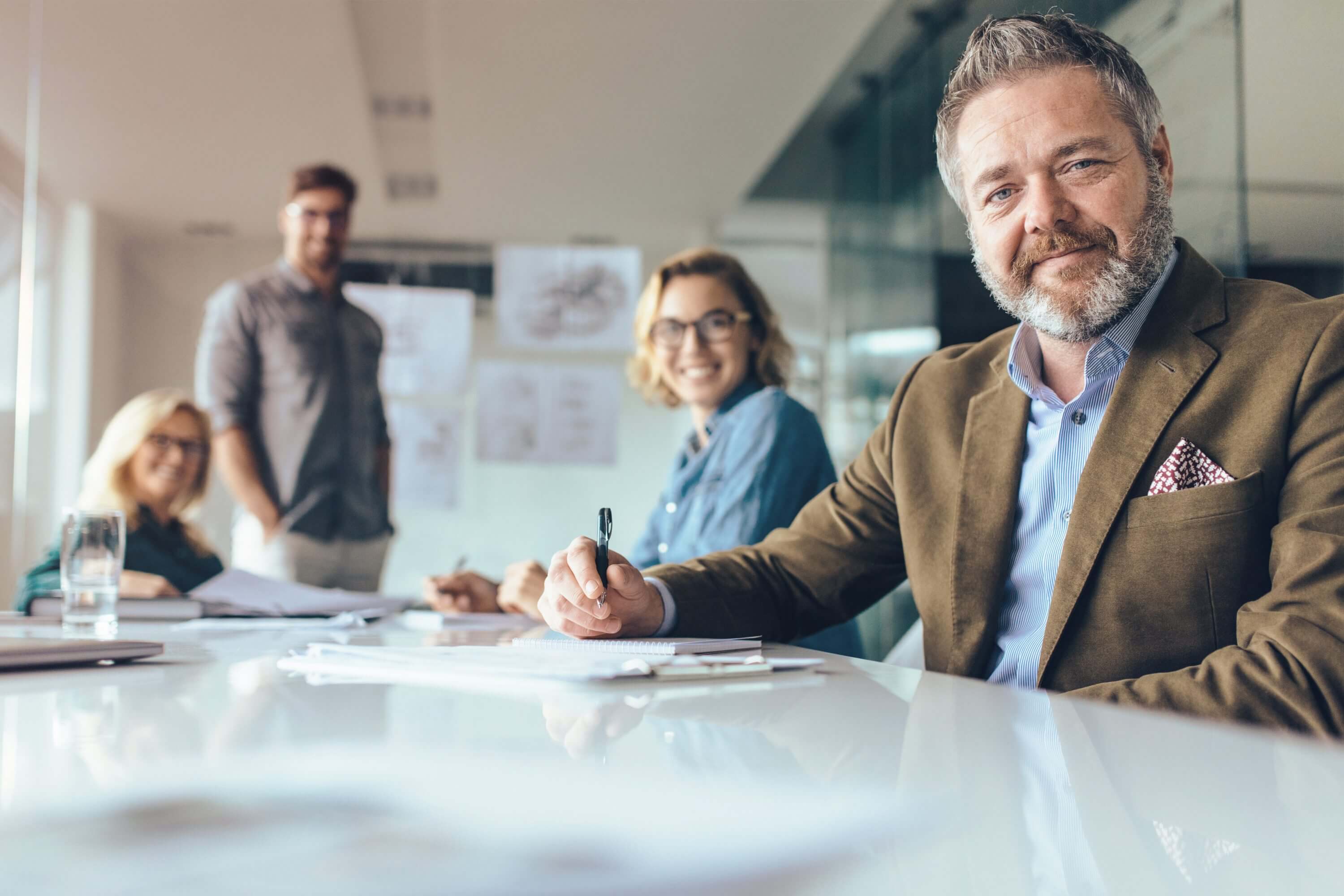 Businesspeople looking at camera with smile